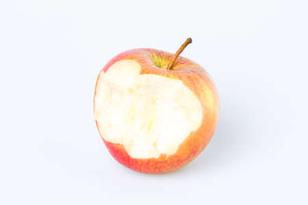 Organic bitten apple isolated on white backgroundの写真素材