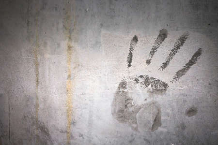 Grungy wall with hand print. It can be used as a backdrop, grungy wallpaper, design t-shirts and...
