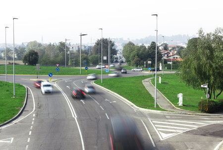 Traffic in the city, jam, flowing with blurred motion.