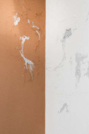 Peeling painted wall, texture, grunge background, cracked paint with orange wall.の写真素材