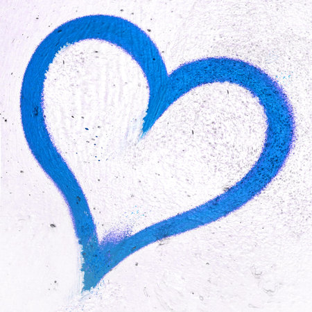 Concept or conceptual painted blue abstract heart shape love symbol, dirty wall background, metaphor...