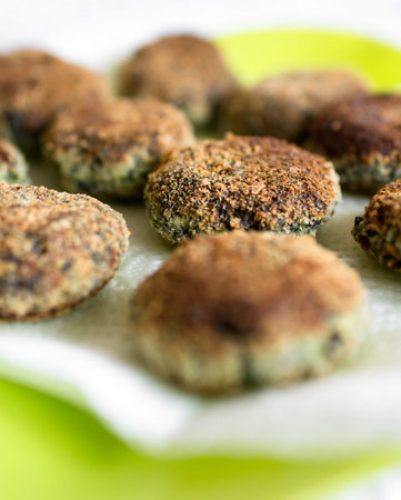 Vegetarian meatballs with spinach. Defocused blurry background.の写真素材