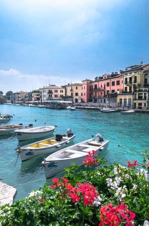 Peschiera del Garda (VR) ITALY - June 2, 2018.  Colorful harbor and boats view.のeditorial素材