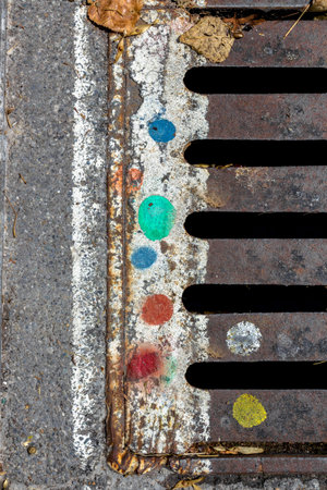 Detail of a manhole with grungy decorations. Ideal for your creative works.