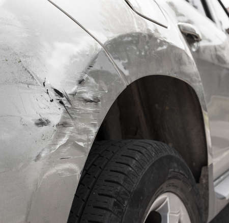 Dents on the car caused by the accident. Close-up.のeditorial素材