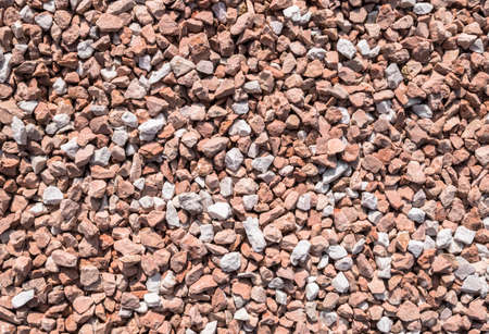 Closeup of little red pebbles. It can be used for texture and backgroundの写真素材