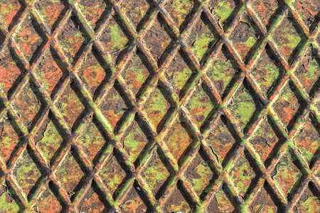 Grungy manhole cover pattern closeup, useful as background.の写真素材