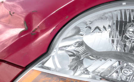 Scratches and dent on the car. Close-up.の写真素材