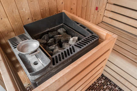 Sauna electric heater with stones in a SPA. Concept of relaxation and healthy lifestyle.の写真素材