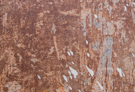 Rusted metal background, with torn pieces of paper.