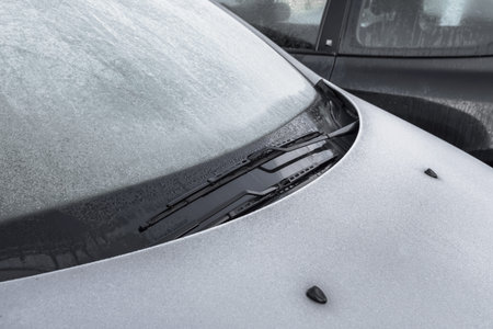 Close-up of an icy car. On background another car. Ideal for concepts.