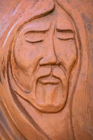Relief sculpture of Jesus' face, made out of modelling clay. Ideal for concepts, events or backgrounds.のeditorial素材