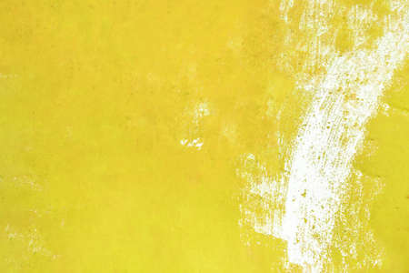 Yellow painted grunge texture. Yellow painted wall paper texture background. の写真素材