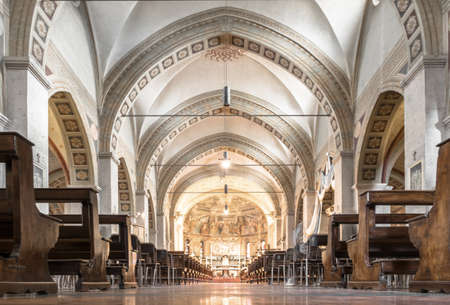 Interior view of a church. Beautiful view on nave from altar inside cathedral church. Interior of catholic basilica with sun rays from windows.のeditorial素材