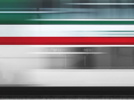 Italian train in motion blur. Blurred motion of the train with Italian flag colors.