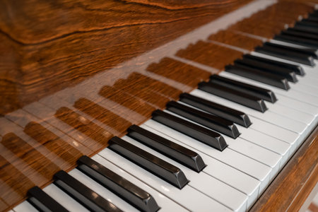Vintage piano keyboard. Old view of piano keyboard with shallow depth of field.の写真素材