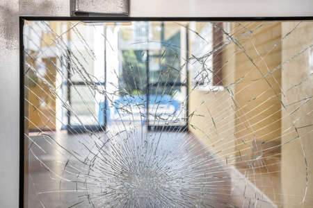 Shattered glass. Concept security theft damage vandalism in an apartment building.の写真素材