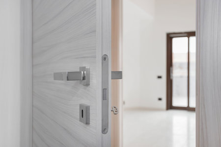 Closeup white open door, Real estate concept door handle.の写真素材