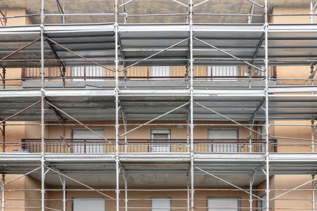 Scaffolding on multi storey building facade during facade renovation