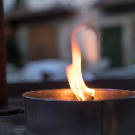 Candle fire flame. Abstract background of candle light on background. Blurry light around. Defocused blurry background.の写真素材