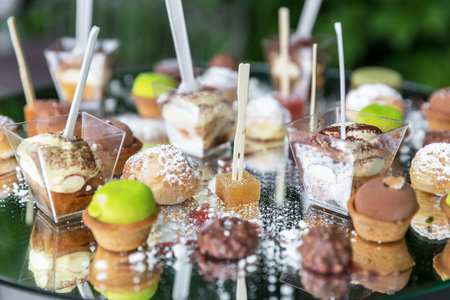 Assortment of delicious and colorful desserts. They all look tasty and delicious. Perfect for parties and events.の写真素材