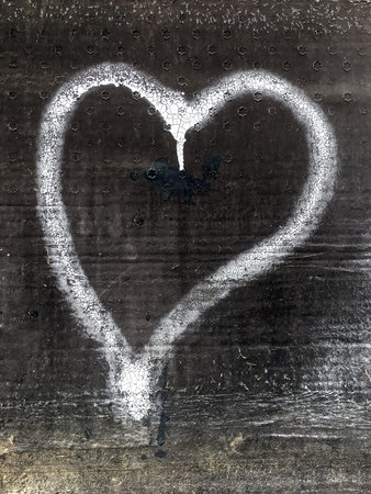 White heart painted on grunge background. Concepts and holidays.の写真素材