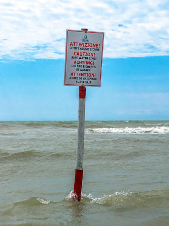 Information sign for swimmers limiting safe waters. Multilingual.の写真素材