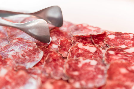 Salami slices close up. Ready for served at an event or party. Appetizer.