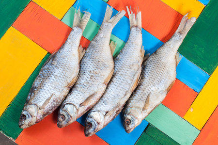 Dried fish hanging on a thread