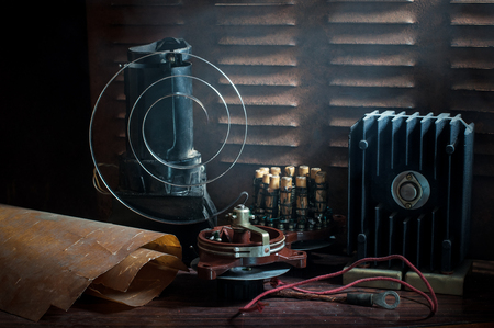 Old electrical appliances on a rusty chairの写真素材