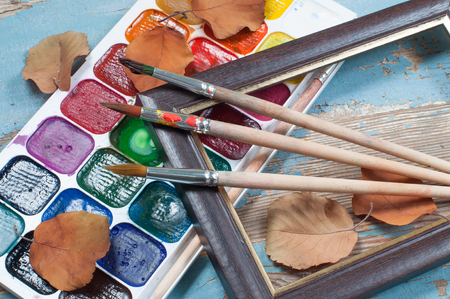 Paint brushes , paint and frame autumnの写真素材