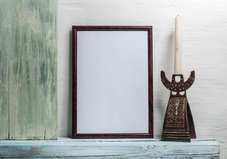 empty frame for an inscription on a wooden shelf
