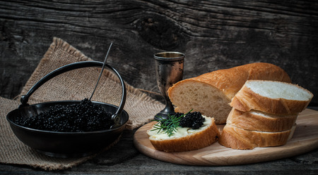 Sandwich with black caviar and butter. Still life with black caviarの写真素材