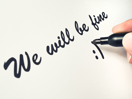 Smile is drawn on a piece of paper with a markerの写真素材