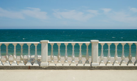 Balustrade on the Black Sea embankment. Beach front of the sea.の写真素材