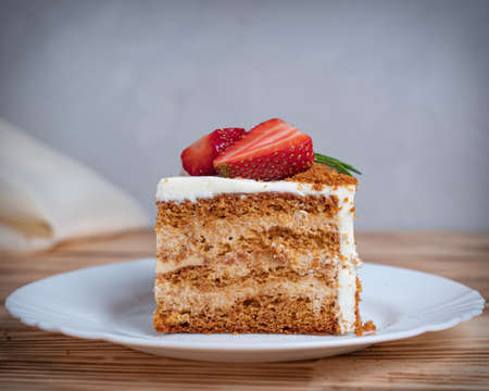 honey cake with strawberries and rosemaryの写真素材