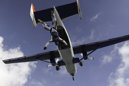 Student skydiver jumps out of an airplane 