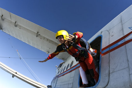 A student parachutist jumps from an airplane 