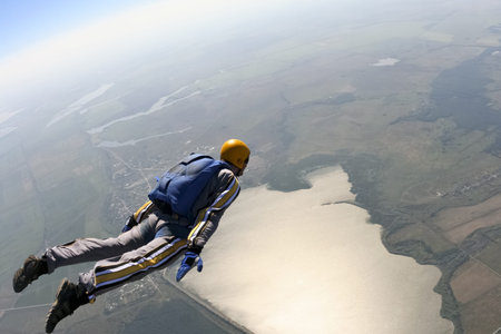 The student skydiver is moving along the horizon.