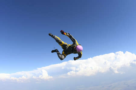 The girl parachutist in free style の写真素材