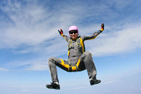 Female skydiver does fall sitting.の写真素材