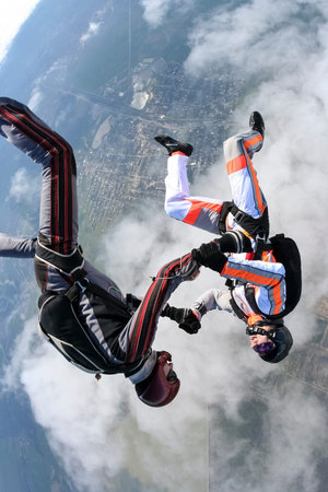 Two parachutists perform freestyle figures 