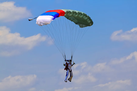 The girl parachutist pilots his parachute 