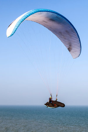 Paragliding flight over the sea 