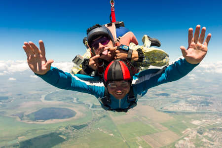 Tandem jump  A student with an instructor in freefall の写真素材