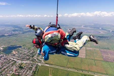 Tandem jump  A student with an instructor in freefall の写真素材
