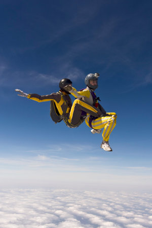 Two parachutists girls in free fall.