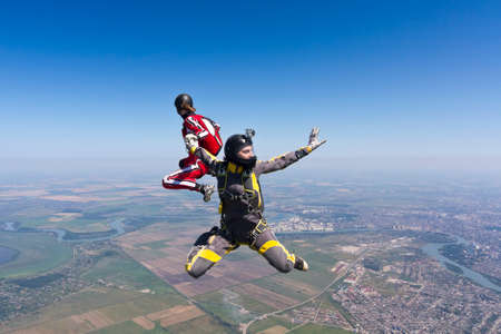 Two parachutists girls in free fall の写真素材