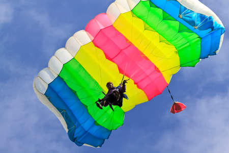 The girl parachutist pilots his parachute.の写真素材