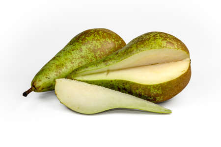 Two green pears and quarter split isolated on white background as package design elementの写真素材